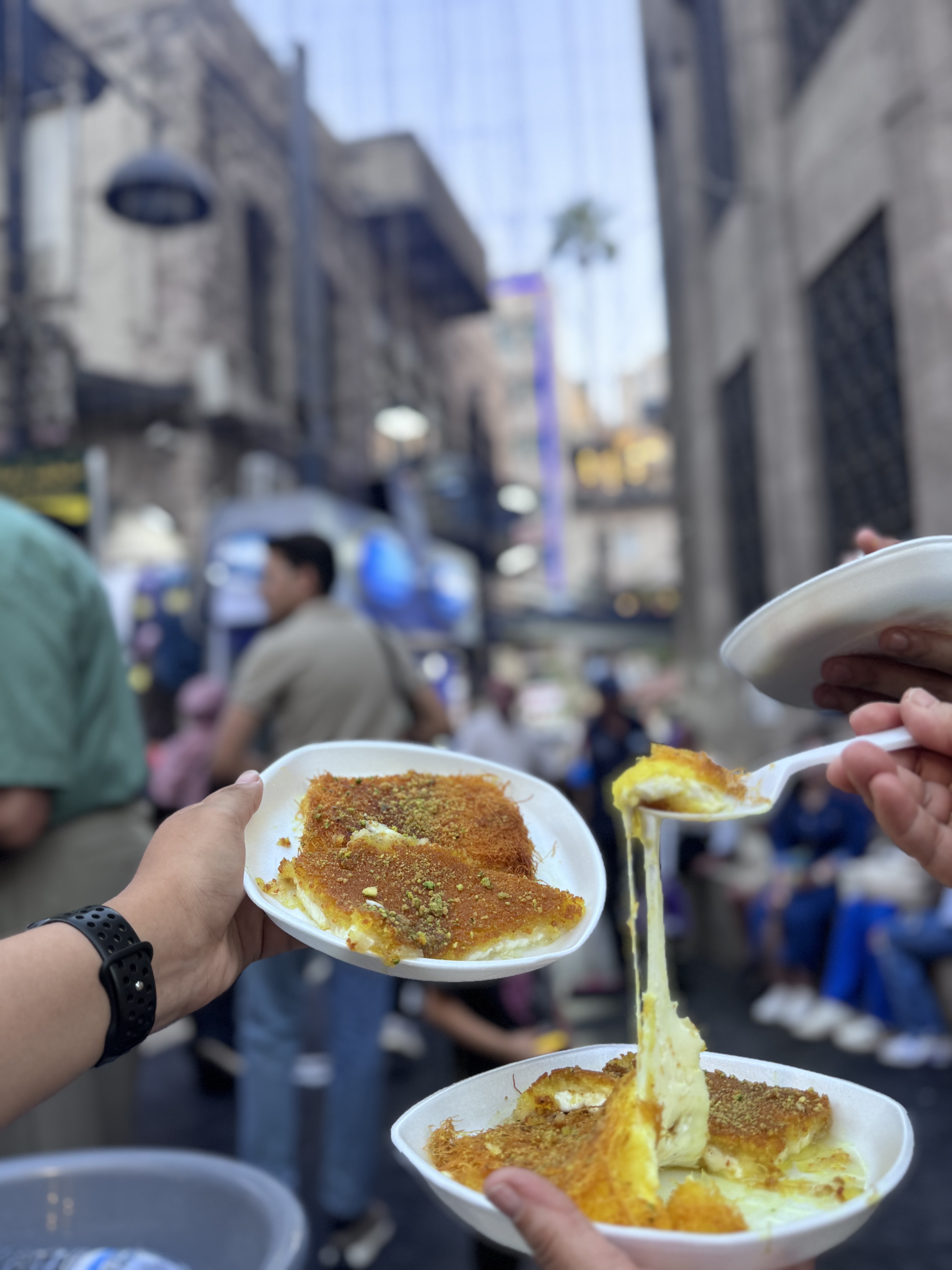 Knafeh being served on the street in downtown Amman Jordan